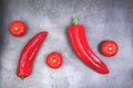 tomatoes and bell peppers over a concrete surface