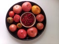 Tomatoes, berries in a plate.