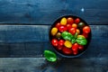 Tomatoes in black bowl