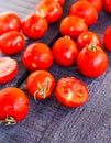 Tomatoes cherry on dark wooden board, closeup Royalty Free Stock Photo