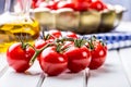 Tomatoes. Cherry tomatoes. Cocktail tomatoes. Fresh grape tomatoes carafe with olive oil Royalty Free Stock Photo