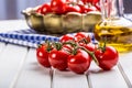 Tomatoes. Cherry tomatoes. Cocktail tomatoes. Fresh grape tomatoes carafe with olive oil Royalty Free Stock Photo