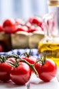 Tomatoes. Cherry tomatoes. Cocktail tomatoes. Fresh grape tomatoes carafe with olive oil Royalty Free Stock Photo