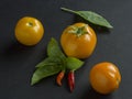 Tomatoes, chilies and basil leaves