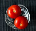 Tomatoes close-up in a small glass vase