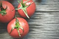 Tomatoes, cooked for the preservation on the old wooden table. Organic food, Cherry tomatoes on wood. Royalty Free Stock Photo