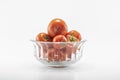 Tomatoes in crystal bowls. White background. It was taken in the studio
