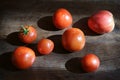 Tomatoes on a dark brown wooden table