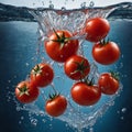 tomatoes falling into water Royalty Free Stock Photo