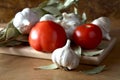 Tomatoes garlic and bay leaf Royalty Free Stock Photo