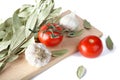 Tomatoes garlic and bay leaf branches Royalty Free Stock Photo