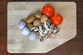 Tomatoes Garlic and Portobello Mushroom on Cutting Board Royalty Free Stock Photo