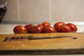 Tomatoes infected with phytophthora near a wooden board