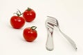 Tomatoes, knife and fork