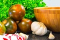 Tomatoes with lattuce, garlic and bamboo bowl