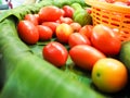 Tomatoes and lemons on banana leaf