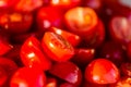 Tomatoes macro, red healthy vegetable sliced on wooden desk. Macro detail of red fresh tomato from garden. Royalty Free Stock Photo