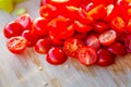 Tomatoes macro, red healthy vegetable sliced on wooden desk. Macro detail of red fresh tomato from garden. Royalty Free Stock Photo