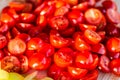 Tomatoes macro, red healthy vegetable sliced on wooden desk. Macro detail of red fresh tomato from garden. Royalty Free Stock Photo