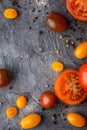 Tomatoes mix with seasoning on the stone table Royalty Free Stock Photo