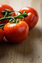 Tomatoes panicles on a wooden chopping board