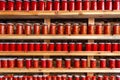 Tomatoes and pepper paste in jars. Tomato paste jars lined up on shelves. Tomato and pepper sauce Royalty Free Stock Photo
