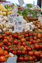 tomatoes on sale at an outdoor market area and vegetable stand Royalty Free Stock Photo
