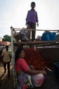 Tomatoes seller with family on pickup truck at local morning mar