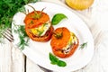 Tomatoes stuffed with meat and rice in plate on board top Royalty Free Stock Photo