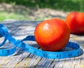 Tomatoes and tape measure Royalty Free Stock Photo