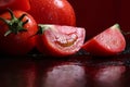 Tomatoes under water drops, red background Royalty Free Stock Photo