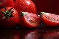 Tomatoes under water drops, red background Royalty Free Stock Photo