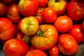 Tomatoes varieties colorful dark background. Top view.
