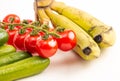 fruits on a white background on sale photo - banana, cucumber and tomatoes