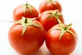 Tomatoes on white. Tomato with drops Royalty Free Stock Photo