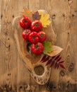 Tomatoes on a wooden board. Tomatoes in autumn arrangement.