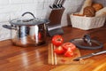 Tomatoes on a wooden board knife kitchen countertops, interior, pan, hob, cooker