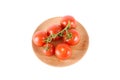 Tomatoes on a wooden plate isolated on white Royalty Free Stock Photo