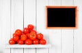 Tomatoes on a wooden shelf. Royalty Free Stock Photo