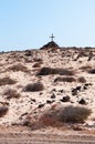 A tomb with a pile of stones and a wooden cross Royalty Free Stock Photo