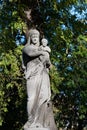 Tomb sculpture of a woman with a child