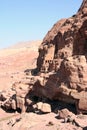 Tombs digged in red rock canyon in Petra surroundings. Jordan