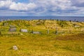 Tombs in the Irish countryside on the island Inis Oirr with the sea in the background