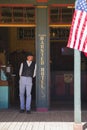 Tombstone, Arizona, USA, April 6, 2015, cowboy and flag in old western town home of Doc Holliday and Wyatt Earp and Gunfight at th Royalty Free Stock Photo