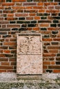 Tombstone on the facade of the Frauenkirche church. Munich