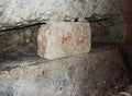 Tombstone with an inscription in Hebrew in the inner room of a necropolis. Bet She`arim, National Park in Kiriyat Tivon city in Is