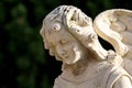 Face angel sculpture with a sweet expression that looks down Royalty Free Stock Photo