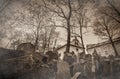 Tombstones on the Old Jewish Cemetery in the Jewish quarter with fog in the autumn season Royalty Free Stock Photo