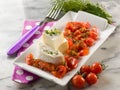 Tomino cheese with pachino tomatoes Royalty Free Stock Photo