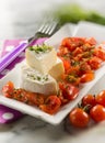 Tomino cheese with pachino tomatoes Royalty Free Stock Photo